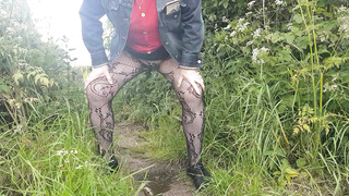 Peeing in field in tights