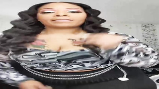 Ebony gal is posing an taunting in front of the camera, in the middle of the day