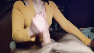 Beefstick lovin’ stunner is providing a hand job to a buddy, in front of the camera