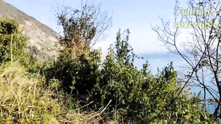 Russian stunner is providing a hand job to a mischievous stud in the nature, during the day