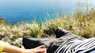 Russian stunner is providing a hand job to a mischievous stud in the nature, during the day