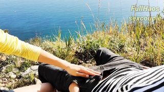 Russian stunner is providing a hand job to a mischievous stud in the nature, during the day