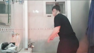 Adorable inexperienced stunner with uber-cute knockers is having a douche in front of the camera