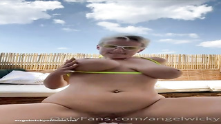 Messy minded, towheaded cougar with XXL tits, Wicky is frolicking with herself in the backyard