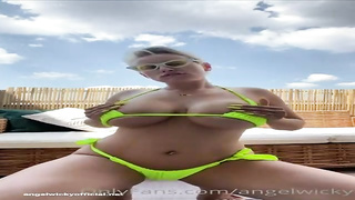 Messy minded, towheaded cougar with XXL tits, Wicky is frolicking with herself in the backyard