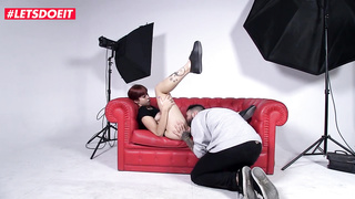 Crimson haired honey with tats, Scarlett Jones is getting frigged in front of the camera