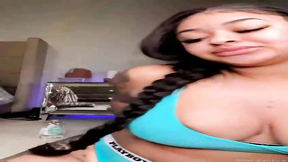 Ebony honey with tats and yam-sized funbags is demonstrating her pierced puffies in front of the camera