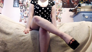 Fetching chick in boots with high high-heeled slippers is demonstrating her ultra-cute gams on live webcam