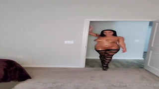 Tatted brown-haired with gigantic cupcakes is dressed in black, fishnet pantyhose while nailing her black paramour