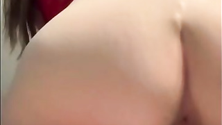 Crimson haired stunner is fellating a glass fake penis before jacking on webcam, late at night