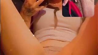 Crimson haired stunner is fellating a glass fake penis before jacking on webcam, late at night