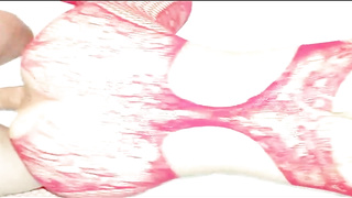 Latin gal with platinum-blonde hair is dressed in crimson, fishnet bodystocking while getting plowed from behind