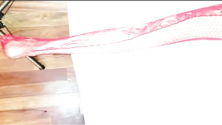 Latin gal with platinum-blonde hair is dressed in crimson, fishnet bodystocking while getting plowed from behind