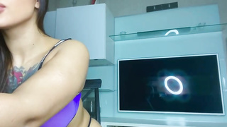 Honey with a huge butt in a g-string taunts and groans while toying with her trimmed cage