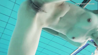 Smallish breasted, Russian dark haired loves to get bare in the swimming pool and knead herself