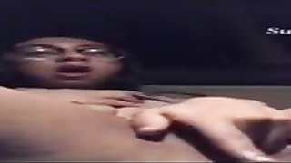 Wild dame with glasses is caressing and frigging her moist cooter in the back of a van