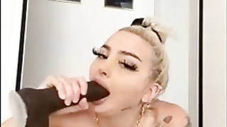 Inked ash-blonde dame with fat orbs, Celine Centino is using a orgy plaything while jacking