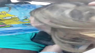 Bone enjoying honey is providing an extraordinaire deep throat to a black man, in the van