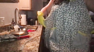 Phat booty housewife is taunting while doing her palace work, because it makes her sense fine