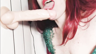 Crimson haired gal is displaying her stiffy fellating abilities on web cam, with a humungous fuck stick