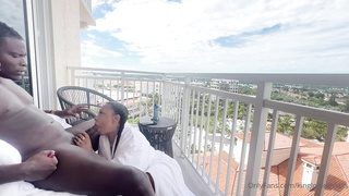 Whorey, Ebony damsel is inhaling her paramour's chisel on the balcony, in the middle of the day