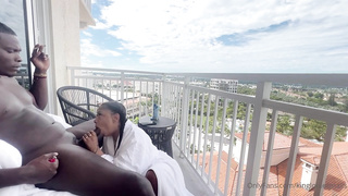 Whorey, Ebony damsel is inhaling her paramour's chisel on the balcony, in the middle of the day