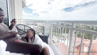 Whorey, Ebony damsel is inhaling her paramour's chisel on the balcony, in the middle of the day