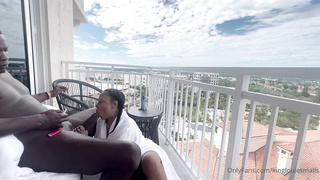 Whorey, Ebony damsel is inhaling her paramour's chisel on the balcony, in the middle of the day