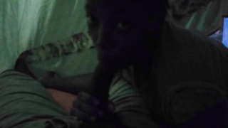 Ebony honey is mildly caressing and fellating her paramour's man rod, in the middle of the night