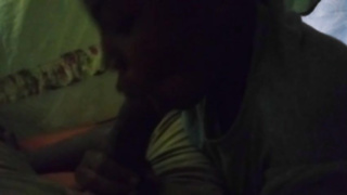 Ebony honey is mildly caressing and fellating her paramour's man rod, in the middle of the night
