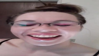 Horny dark haired in black fishnets is jerking with a orgy fucktoy, in front of the camera