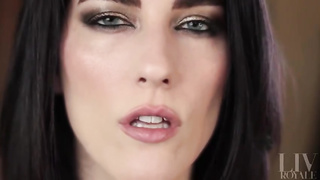 Nymph with dark hair and exotic make-up showcases off her tongue abilities for those with a hatch fetish