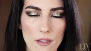 Nymph with dark hair and exotic make-up showcases off her tongue abilities for those with a hatch fetish