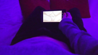 Chick POINT OF VIEW of a nymph draining in a dim-lit apartment while observing manga porn on her smartphone