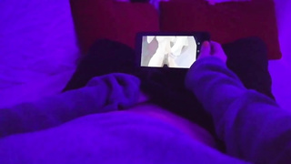 Chick POINT OF VIEW of a nymph draining in a dim-lit apartment while observing manga porn on her smartphone