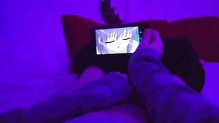 Chick POINT OF VIEW of a nymph draining in a dim-lit apartment while observing manga porn on her smartphone