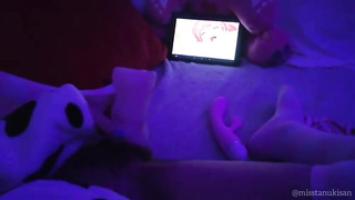 Wild Asian fuckslut dims the light and plays with her cunny while witnessing anime porn on her smartphone