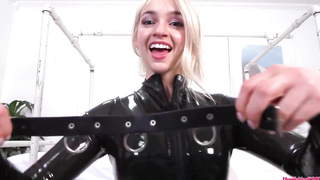 Insane blondie honey is dressed in a black, spandex costume while posing and taunting on web cam