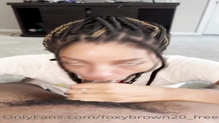 Naive Ebony stunner is anxiously blowing a ample, black knob while getting down on all fours on the floor