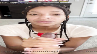 Naive Ebony stunner is anxiously blowing a ample, black knob while getting down on all fours on the floor