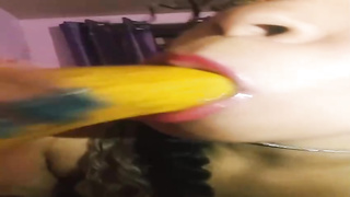 Fledgling brown-haired with curly hair is displaying her man rod deep-throating routine with a yam-sized banana