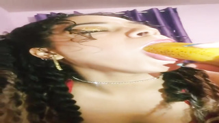 Fledgling brown-haired with curly hair is displaying her man rod deep-throating routine with a yam-sized banana