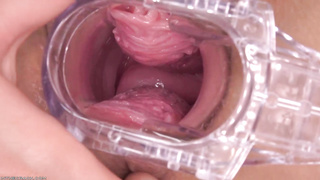 Taissia Shanti is using a gynecologist's implement and thumbs while milking in front of the camera