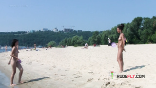 Bombastic young nudist babes sunbathe nude at the beach