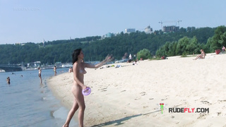 Bombastic young nudist babes sunbathe nude at the beach