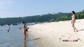 Bombastic young nudist babes sunbathe nude at the beach