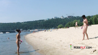 Bombastic young nudist babes sunbathe nude at the beach