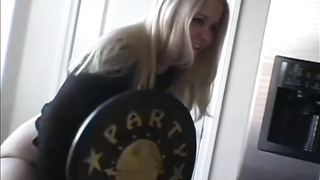 Delectable light-haired stunner, Christine is posing and taunting in glamour clothes, while alone at home