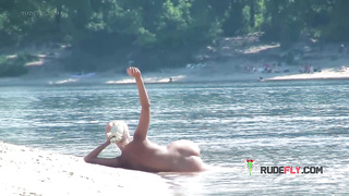 Playful blond nudist teen