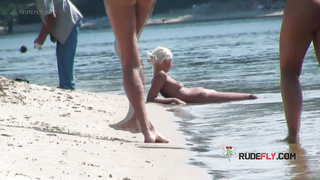 Playful blond nudist teen